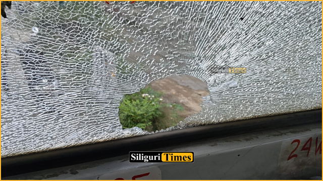 Stone hurled at moving NBSTC bus near Rajganj; rear glass shattered, passengers escape major mishap