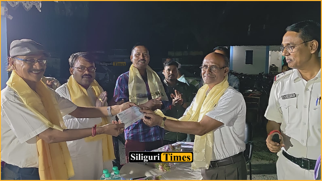 MLA Dinesh Sarkar hands over state government grant cheques to 47 Durga Puja committees in Rajganj